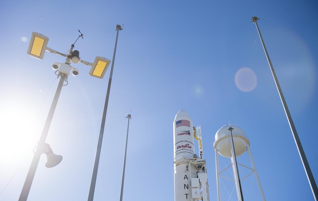 The Orbital Sciences Corporation Antares rocket, with the Cygnus spacecraft onboard, is seen on launch Pad-0A, Sunday, Oct. 26, 2014, at NASA's Wallops Flight Facility in Virginia. The Antares will launch with the Cygnus spacecraft filled with over 5,000 pounds of supplies for the International Space Station, including science experiments, experiment hardware, spare parts, and crew provisions. The Orbital-3 mission is Orbital Sciences' third contracted cargo delivery flight to the space station for NASA. Launch is scheduled for Monday, Oct. 27 at 6:45 p.m. EDT. Photo Credit: (NASA/Joel Kowsky)