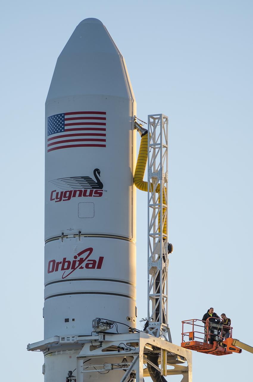 The Orbital Sciences Corporation Antares rocket, with the Cygnus spacecraft onboard, is seen on launch Pad-0A, Sunday, Oct. 26, 2014, at NASA's Wallops Flight Facility in Virginia. The Antares will launch with the Cygnus spacecraft filled with over 5,000 pounds of supplies for the International Space Station, including science experiments, experiment hardware, spare parts, and crew provisions. The Orbital-3 mission is Orbital Sciences' third contracted cargo delivery flight to the space station for NASA. Launch is scheduled for Monday, Oct. 27 at 6:45 p.m. EDT. Photo Credit: (NASA/Joel Kowsky)