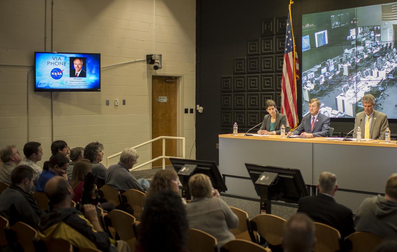 William Gerstenmaier, associate administrator of NASA's Human Exploration and Operations Mission Directorate, participates via phone, in a press conference with Rachel Kraft, NASA public affairs officer, seated left, Frank Culbertson, Executive Vice President and General Manager of Advanced Program Group at Orbital Sciences Corp., center, and Bill Wrobel, director of NASA's Wallops Flight Facility, after a mishap occurred during the launch of the Antares rocket, with the Cygnus cargo spacecraft aboard, Tuesday, Oct. 28, 2014, NASA Wallops Flight Facility, Virginia.  Michael Suffredini, NASA's International Space Station Program Manager also participated via phone.  Cygnus was on its way to rendezvous with the space station. The Antares rocket lifted off to start its third resupply mission to the International Space Station, but suffered a catastrophic anomaly shortly after liftoff at 6:22 p.m. EDT. Photo Credit: (NASA/Joel Kowsky)