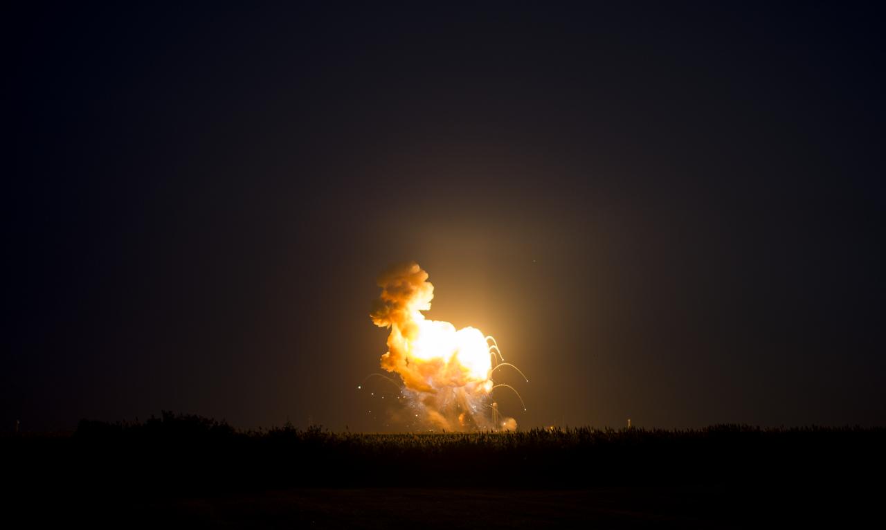 The Orbital Sciences Corporation Antares rocket, with the Cygnus spacecraft onboard suffers a catastrophic anomaly moments after launch from the Mid-Atlantic Regional Spaceport Pad 0A, Tuesday, Oct. 28, 2014, at NASA's Wallops Flight Facility in Virginia. The Cygnus spacecraft was filled with about 5,000 pounds of supplies slated for the International Space Station, including science experiments, experiment hardware, spare parts, and crew provisions. Photo Credit: (NASA/Joel Kowsky)
