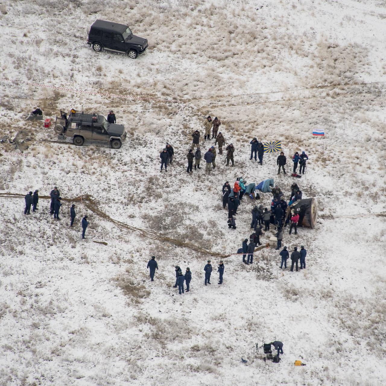 Ground support personnel are seen at the landing site after the Soyuz TMA-13M spacecraft landed with Expedition 41 Commander Max Suraev of the Russian Federal Space Agency (Roscosmos), NASA Flight Engineer Reid Wiseman and Flight Engineer Alexander Gerst of the European Space Agency (ESA) near the town of Arkalyk, Kazakhstan on Monday, Nov. 10, 2014. Suraev, Wiseman and Gerst returned to Earth after more than five months onboard the International Space Station where they served as members of the Expedition 40 and 41 crews. Photo Credit: (NASA/Bill Ingalls)
