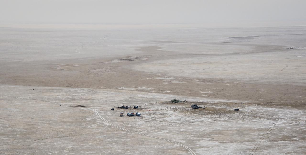 Ground support personnel are seen at the landing site after the Soyuz TMA-13M spacecraft landed with Expedition 41 Commander Max Suraev of the Russian Federal Space Agency (Roscosmos), NASA Flight Engineer Reid Wiseman and Flight Engineer Alexander Gerst of the European Space Agency (ESA) near the town of Arkalyk, Kazakhstan on Monday, Nov. 10, 2014. Suraev, Wiseman and Gerst returned to Earth after more than five months onboard the International Space Station where they served as members of the Expedition 40 and 41 crews. Photo Credit: (NASA/Bill Ingalls)