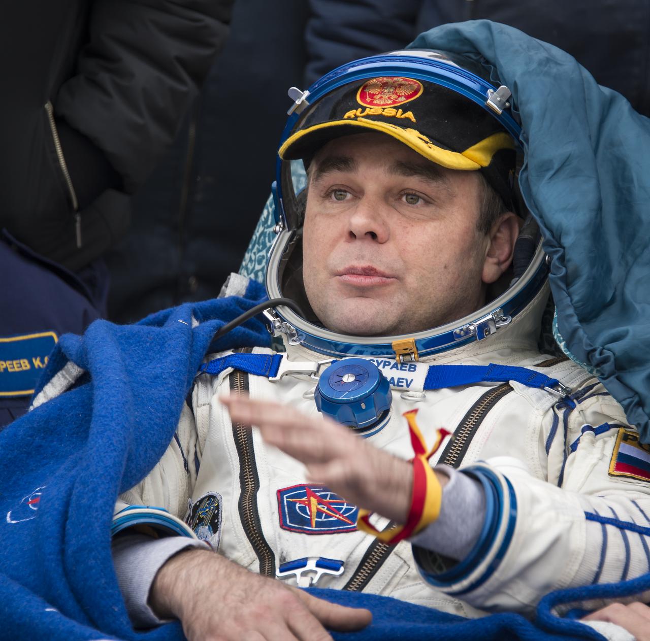 Expedition 41 Commander Max Suraev of the Russian Federal Space Agency (Roscosmos) rests in a chair outside the Soyuz Capsule just minutes after he and NASA Flight Engineer Reid Wiseman, and Flight Engineer Alexander Gerst of the European Space Agency (ESA) landed in their Soyuz TMA-13M capsule in a remote area near the town of Arkalyk, Kazakhstan on Monday, Nov. 10, 2014. Suraev, Wiseman and Gerst returned to Earth after more than five months onboard the International Space Station where they served as members of the Expedition 40 and 41 crews. Photo Credit: (NASA/Bill Ingalls)