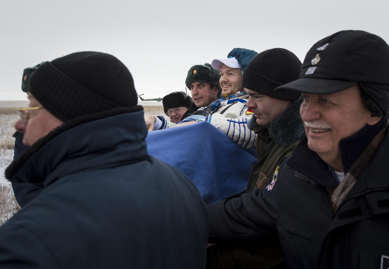 Expedition 41 Flight Engineer Alexander Gerst of the European Space Agency (ESA) is carried in a chair to a medical tent after he and Expedition 41 Commander Max Suraev of the Russian Federal Space Agency (Roscosmos), and NASA Flight Engineer Reid Wiseman landed in their Soyuz TMA-13M capsule in a remote area near the town of Arkalyk, Kazakhstan on Monday, Nov. 10, 2014. Suraev, Wiseman and Gerst returned to Earth after more than five months onboard the International Space Station where they served as members of the Expedition 40 and 41 crews. Photo Credit: (NASA/Bill Ingalls)