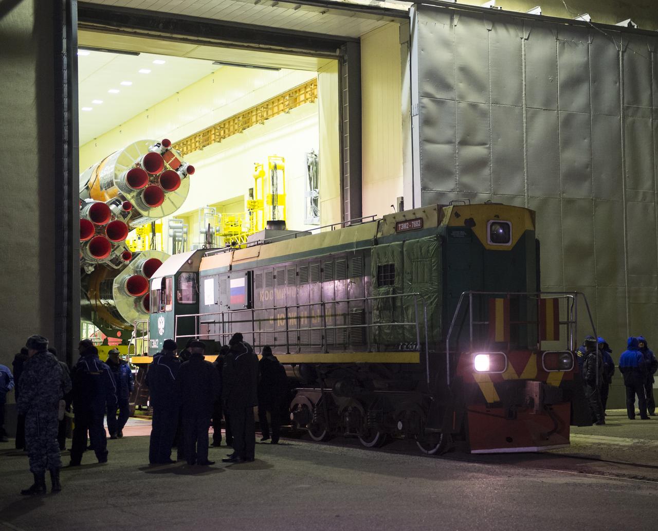 The Soyuz rocket is prepared to be rolled out by train to the launch pad on Friday, Nov. 21, 2014 at the Baikonur Cosmodrome in Kazakhstan. The Soyuz TMA-15M spacecraft, scheduled to launch Nov. 24, will carry Expedition 42 Soyuz Commander Anton Shkaplerov of the Russian Federal Space Agency (Roscosmos), Flight Engineer Terry Virts of NASA , and Flight Engineer Samantha Cristoforetti of the European Space Agency into orbit to begin their five and a half month mission on the International Space Station. Photo Credit: (NASA/Aubrey Gemignani)