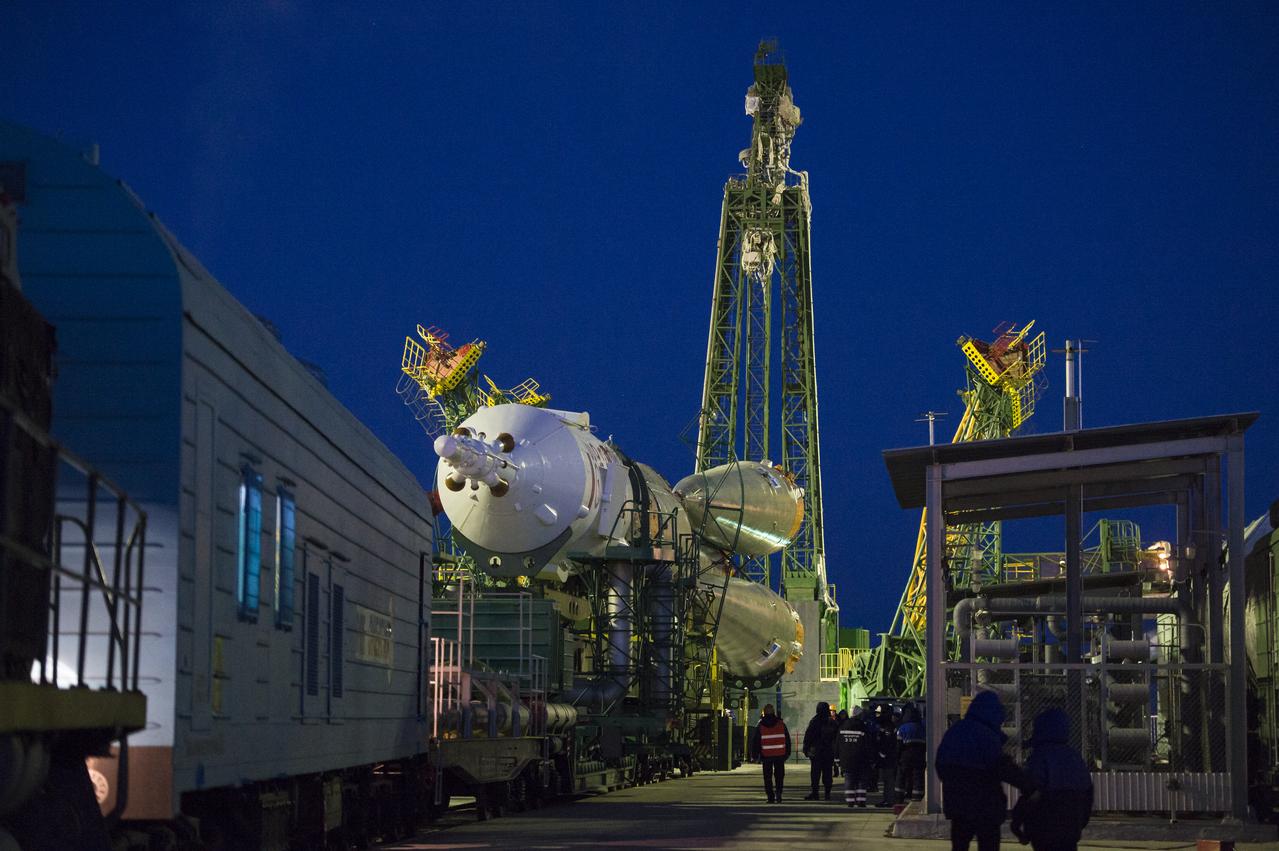 The Soyuz TMA-15M spacecraft is seen shortly after arriving at the launch pad by train on Friday, Nov. 21, 2014, at the Baikonur Cosmodrome in Kazakhstan.  Launch of the Soyuz rocket is scheduled for Nov. 24 and will carry Expedition 42 Soyuz Commander Anton Shkaplerov of the Russian Federal Space Agency (Roscosmos), Flight Engineer Terry Virts of NASA , and Flight Engineer Samantha Cristoforetti of the European Space Agency into orbit to begin their five and a half month mission on the International Space Station. Photo Credit: (NASA/Aubrey Gemignani)