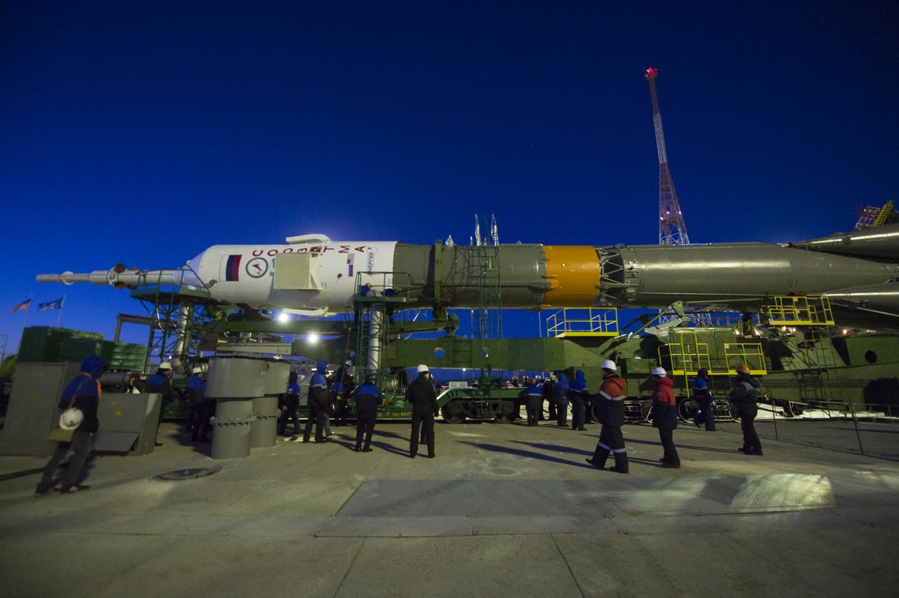 Workers prepare to raise the Soyuz TMA-15M spacecraft into the vertical position on Friday, Nov. 21, 2014 at the Baikonur Cosmodrome in Kazakhstan. Launch of the Soyuz rocket is scheduled for Nov. 24 and will carry Expedition 42 Soyuz Commander Anton Shkaplerov of the Russian Federal Space Agency (Roscosmos), Flight Engineer Terry Virts of NASA, and Flight Engineer Samantha Cristoforetti of the European Space Agency into orbit to begin their five and a half month mission on the International Space Station. Photo Credit: (NASA/Aubrey Gemignani)