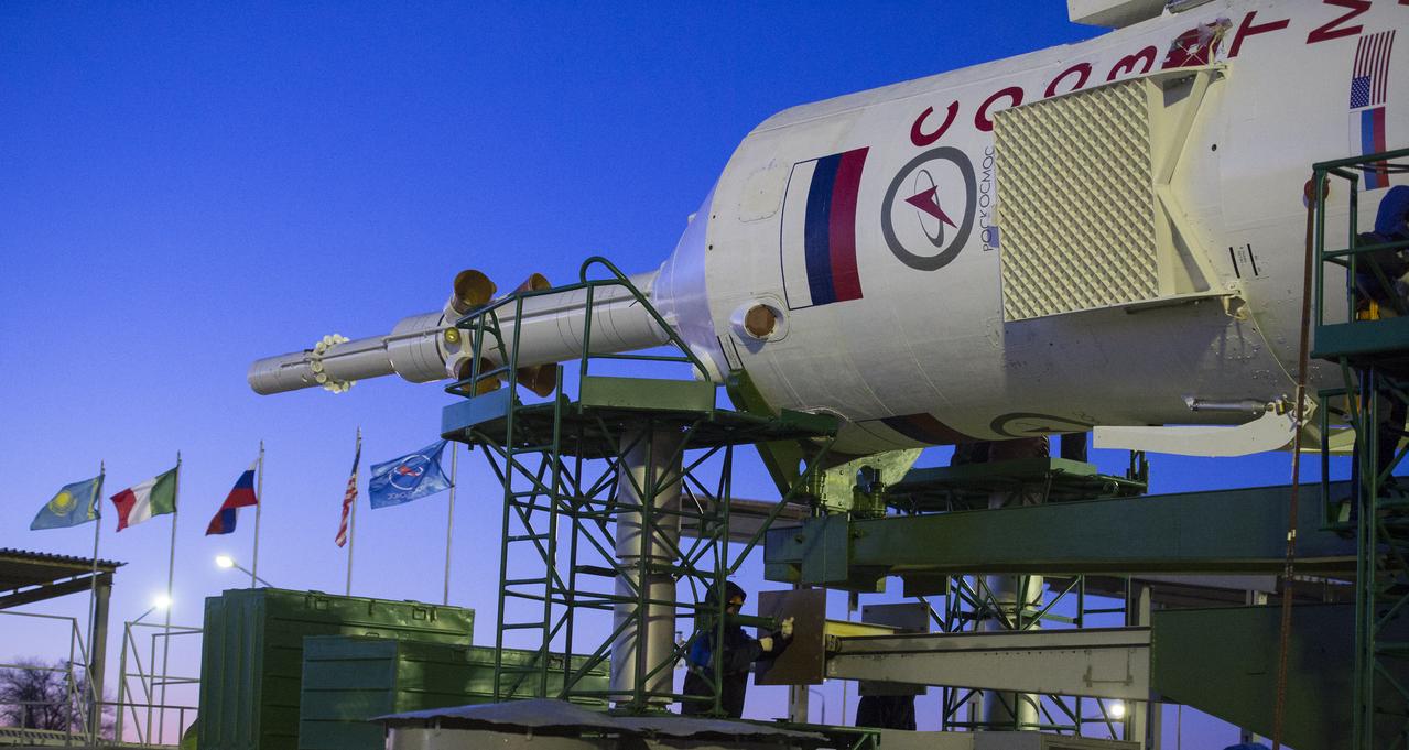 The Soyuz TMA-15M spacecraft is seen shortly after arriving at the launch pad by train on Friday, Nov. 21, 2014, at the Baikonur Cosmodrome in Kazakhstan.  Launch of the Soyuz rocket is scheduled for Nov. 24 and will carry Expedition 42 Soyuz Commander Anton Shkaplerov of the Russian Federal Space Agency (Roscosmos), Flight Engineer Terry Virts of NASA , and Flight Engineer Samantha Cristoforetti of the European Space Agency into orbit to begin their five and a half month mission on the International Space Station. Photo Credit: (NASA/Aubrey Gemignani)