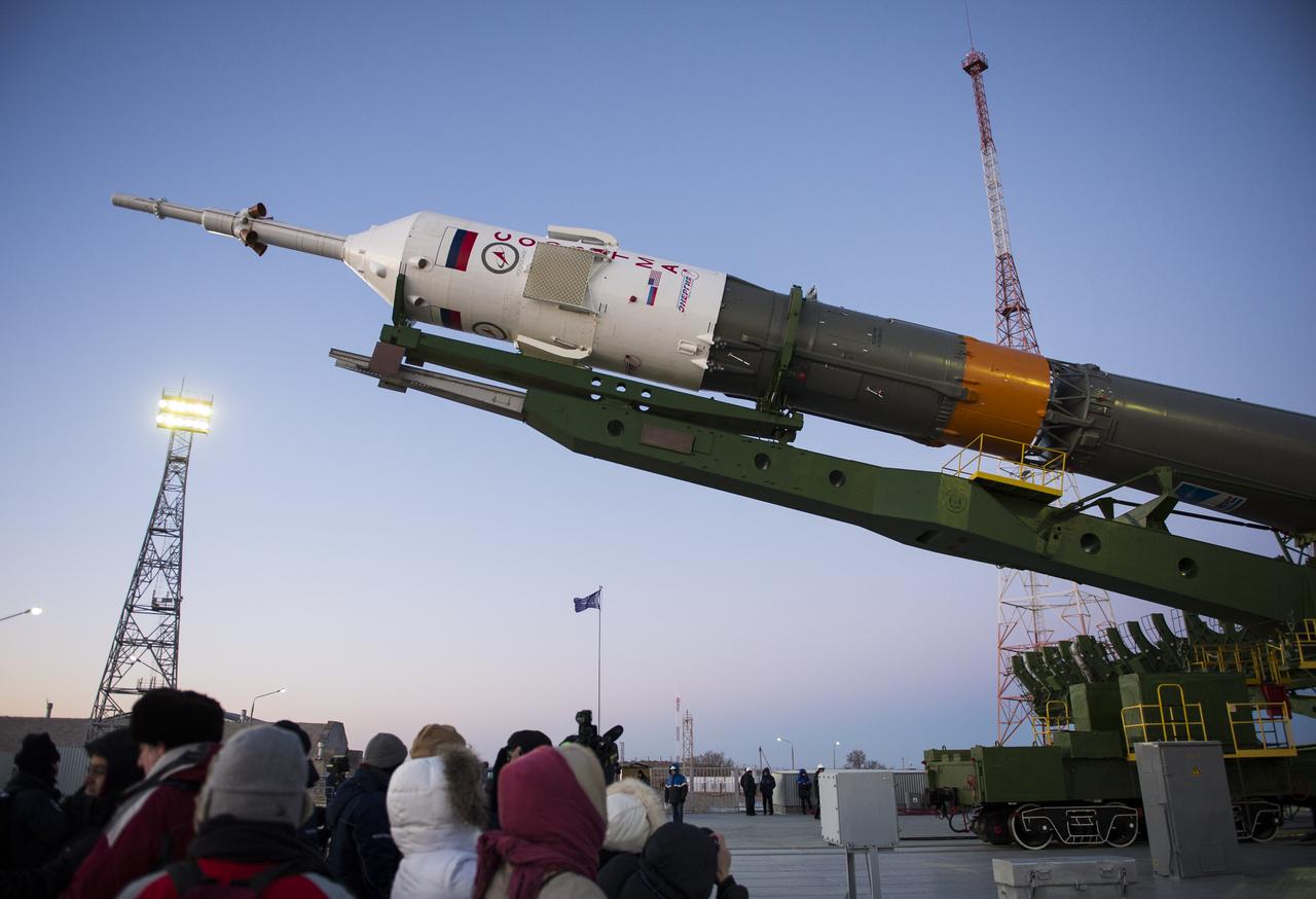 The Soyuz TMA-15M spacecraft is raised into position on the launch pad Friday, Nov. 21, 2014 at the Baikonur Cosmodrome in Kazakhstan. Launch of the Soyuz rocket is scheduled for Nov. 24 and will carry Expedition 42 Soyuz Commander Anton Shkaplerov of the Russian Federal Space Agency (Roscosmos), Flight Engineer Terry Virts of NASA , and Flight Engineer Samantha Cristoforetti of the European Space Agency into orbit to begin their five and a half month mission on the International Space Station. Photo Credit: (NASA/Aubrey Gemignani)