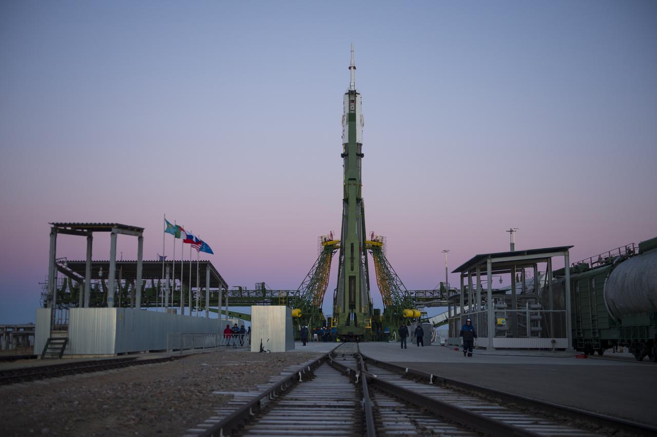 The Soyuz TMA-15M spacecraft is seen after being raised into a vertical position on the launch pad on Friday, Nov. 21, 2014 at the Baikonur Cosmodrome in Kazakhstan.  Launch of the Soyuz rocket is scheduled for Nov. 24 and will carry Expedition 42 Soyuz Commander Anton Shkaplerov of the Russian Federal Space Agency (Roscosmos), Flight Engineer Terry Virts of NASA , and Flight Engineer Samantha Cristoforetti of the European Space Agency into orbit to begin their five and a half month mission on the International Space Station. Photo Credit: (NASA/Aubrey Gemignani)