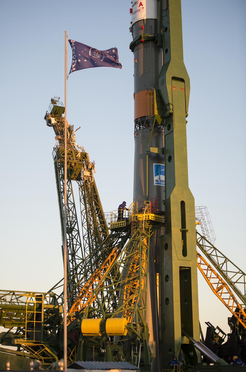The Soyuz TMA-15M spacecraft is seen after being raised into a vertical position on the launch pad on Friday, Nov. 21, 2014 at the Baikonur Cosmodrome in Kazakhstan.  Launch of the Soyuz rocket is scheduled for Nov. 24 and will carry Expedition 42 Soyuz Commander Anton Shkaplerov of the Russian Federal Space Agency (Roscosmos), Flight Engineer Terry Virts of NASA , and Flight Engineer Samantha Cristoforetti of the European Space Agency into orbit to begin their five and a half month mission on the International Space Station. Photo Credit: (NASA/Aubrey Gemignani)