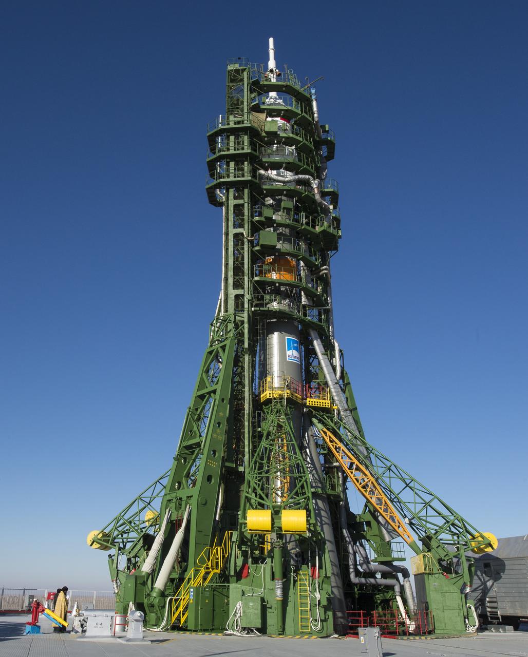 An Orthodox priest blesses the Soyuz rocket at the Baikonur Cosmodrome launch pad on Saturday Nov. 22, 2014, in Kazakhstan.  Launch of the Soyuz rocket is scheduled for Nov. 24 and will carry Expedition 42 Soyuz Commander Anton Shkaplerov of the Russian Federal Space Agency (Roscosmos), Flight Engineer Terry Virts of NASA , and Flight Engineer Samantha Cristoforetti of the European Space Agency into orbit to begin their five and a half month mission on the International Space Station. Photo Credit: (NASA/Aubrey Gemignani)