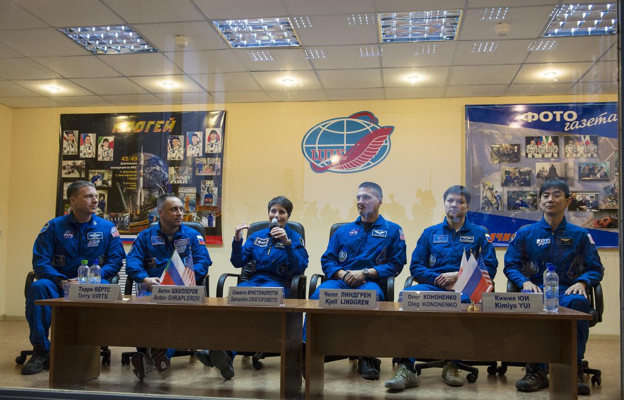 Expedition 42 prime crew members, Flight Engineer Terry Virts of NASA (far left), Soyuz Commander Anton Shkaplerov of the Russian Federal Space Agency (Roscosmos)(second left), and Flight Engineer Samantha Cristoforetti (center) of the European Space Agency are seen with Expedition 42 back up crew members, Flight Engineer Kjell Lindgren of NASA (third right), Soyuz Commander Oleg Kononenko of the Russian Federal Space Agency (Roscosmos) (second right), and Flight Engineeer Kimiya Yui of the Japan Aerospace Exploration Agency (JAXA) (far right) during a press conference held at the Cosmonaut Hotel in Baikonur, Kazakhstan on Saturday, Nov. 22, 2014. The mission is set to launch Nov. 24 from the Baikonur Cosmodrome. Photo Credit: (NASA/Aubrey Gemignani)