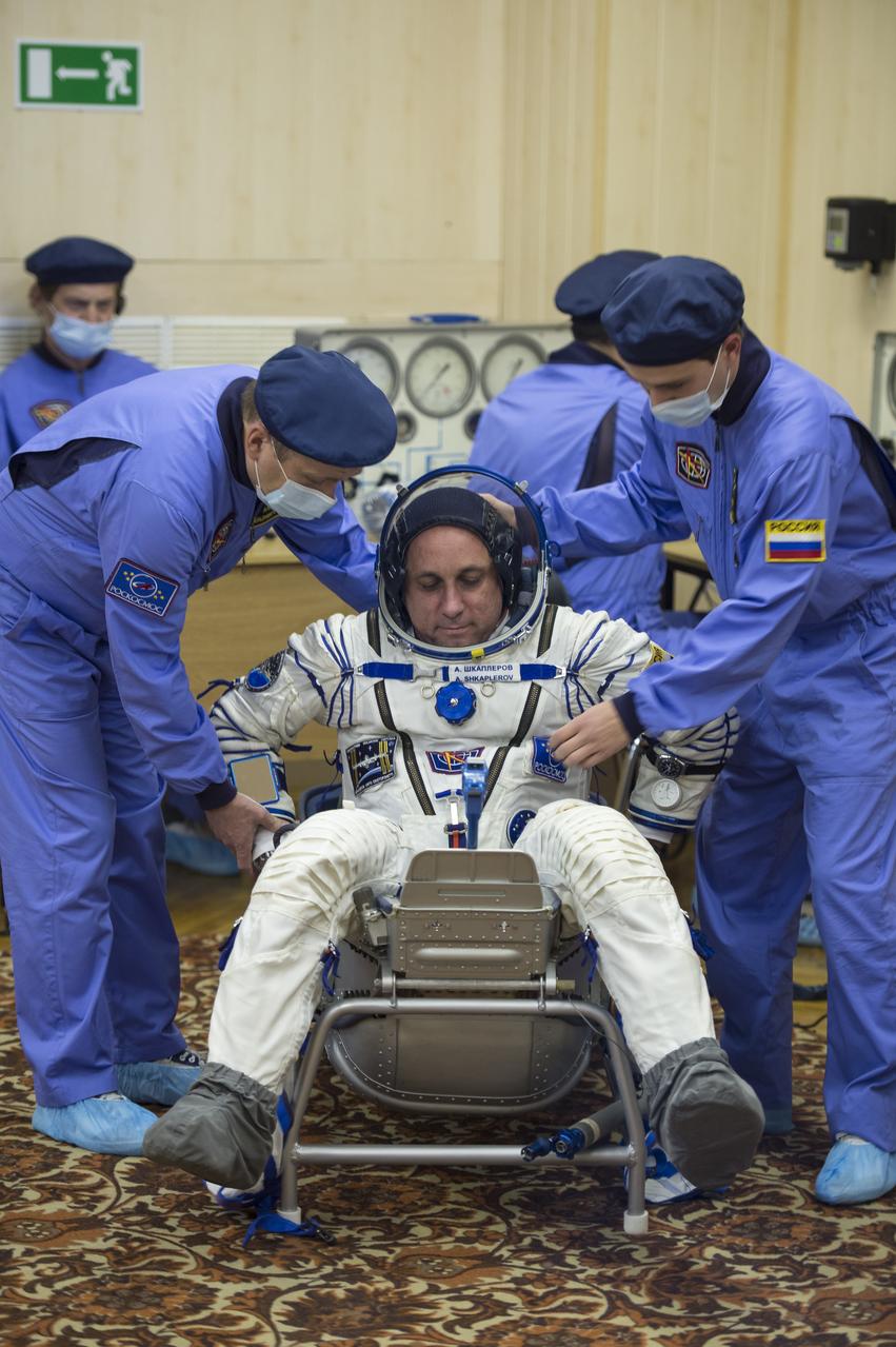 Expedition 42 Soyuz Commander Anton Shkaplerov of the Russian Federal Space Agency (Roscosmos) has his Russian Sokol suit pressure checked in preparation for his launch aboard the Soyuz TMA-15M spacecraft on Sunday, Nov. 23, 2014, at Building 254 in the Baikonur Cosmodrome in Baikonur, Kazakhstan. Launch of the Soyuz rocket is scheduled for the early hours of Nov. 24 and will carry Shkaplerov and fellow crewmates, Flight Engineers Terry Virts of NASA and Samantha Cristoforetti of the European Space Agency (ESA) into orbit to begin their five and a half month mission on the International Space Station. Photo Credit: (NASA/Aubrey Gemignani)