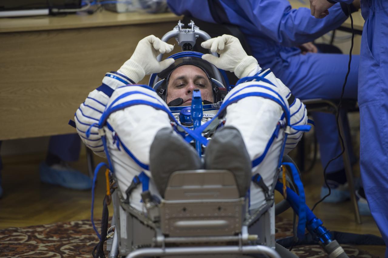 Expedition 42 Soyuz Commander Anton Shkaplerov of the Russian Federal Space Agency (Roscosmos) has his Russian Sokol suit pressure checked in preparation for his launch aboard the Soyuz TMA-15M spacecraft on Sunday, Nov. 23, 2014, at Building 254 in the Baikonur Cosmodrome in Baikonur, Kazakhstan. Launch of the Soyuz rocket is scheduled for the early hours of Nov. 24 and will carry Shkaplerov and fellow crewmates, Flight Engineers Terry Virts of NASA and Samantha Cristoforetti of the European Space Agency (ESA) into orbit to begin their five and a half month mission on the International Space Station. Photo Credit: (NASA/Aubrey Gemignani)