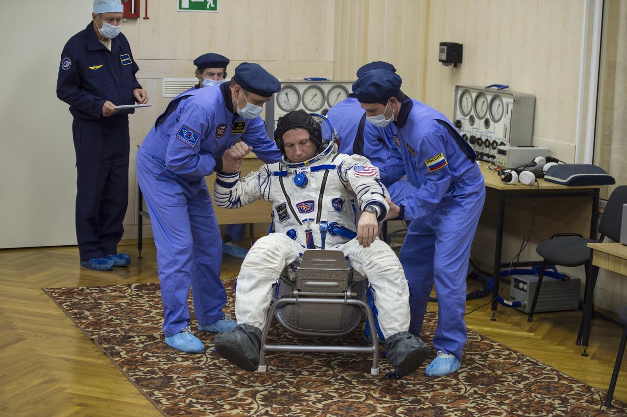 Expedition 42 Flight Engineer Terry Virts has his Russian Sokol suit pressure checked in preparation for his launch aboard the Soyuz TMA-15M spacecraft on Sunday, Nov. 23, 2014, at the Baikonur Cosmodrome in Baikonur, Kazakhstan. Launch of the Soyuz rocket is scheduled for the early hours of Nov. 24 and will carry Virts and fellow crewmates, Flight Engineer Samantha Cristoforetti of the European Space Agency (ESA) and Soyuz Commander Anton Shkaplerov of the Russian Federal Space Agency (Roscosmos) into orbit to begin their five and a half month mission on the International Space Station. Photo Credit: (NASA/Aubrey Gemignani)