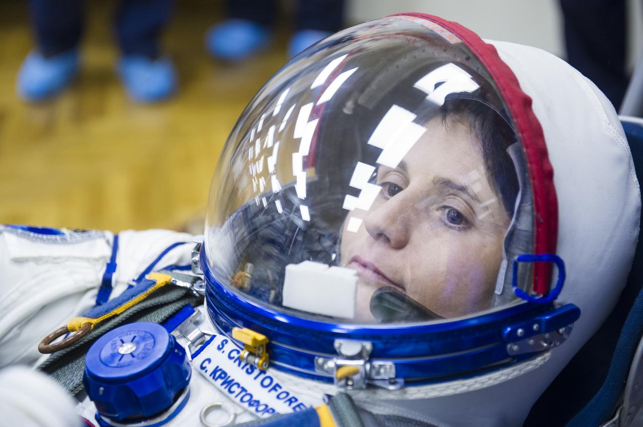 Expedition 42 Flight Engineer Samantha Cristoforetti of the European Space Agency (ESA) has her Russian Sokol suit pressure checked in preparation for her launch aboard the Soyuz TMA-15M spacecraft on Sunday, Nov. 23, 2014, at the Baikonur Cosmodrome in Baikonur, Kazakhstan. Launch of the Soyuz rocket is scheduled for the early hours of Nov. 24 and will carry Cristoforetti and fellow crewmates, Soyuz Commander Anton Shkaplerov of the Russian Federal Space Agency (Roscosmos), and Flight Engineer Terry Virts of NASA, into orbit to begin their five and a half month mission on the International Space Station. Photo Credit: (NASA/GCTC/Andrey Shelepin)
