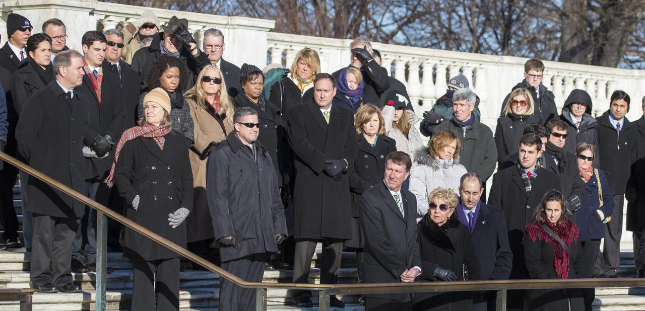 NASA personnel watch as a wreath is laid at the Tomb of the Unknowns by NASA Administrator Charles Bolden as part of NASA's Day of Remembrance, Wednesday, Jan. 28, 2015, at Arlington National Cemetery in Arlington, Va.  The wreaths were laid in memory of those men and women who lost their lives in the quest for space exploration.  Photo Credit: (NASA/Joel Kowsky)