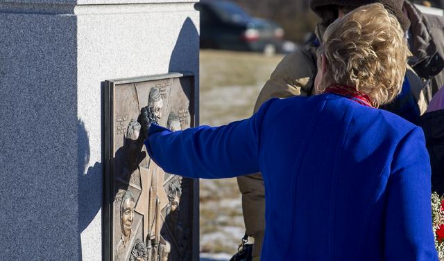 June Scobee Rodgers, widow of Challenger Space Shuttle Commander Dick Scobee, visits the Space Shuttle Challenger Memorial durring a wreath laying ceremony that was part of NASA's Day of Remembrance, Wednesday, Jan. 28, 2015, at Arlington National Cemetery in Arlington, Va.  The wreaths were laid in memory of those men and women who lost their lives in the quest for space exploration.  Photo Credit: (NASA/Joel Kowsky)