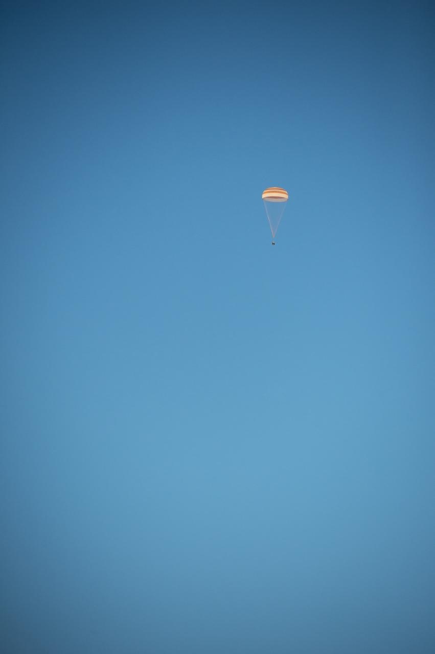 The Soyuz TMA-14M spacecraft is seen as it lands with Expedition 42 commander Barry Wilmore of NASA, Alexander Samokutyaev of the Russian Federal Space Agency (Roscosmos) and Elena Serova of Roscosmos near the town of Zhezkazgan, Kazakhstan on Thursday, March 12, 2015. NASA Astronaut Wilmore, Russian Cosmonauts Samokutyaev and Serova are returning after almost six months onboard the International Space Station where they served as members of the Expedition 41 and 42 crews. Photo Credit: (NASA/Bill Ingalls)