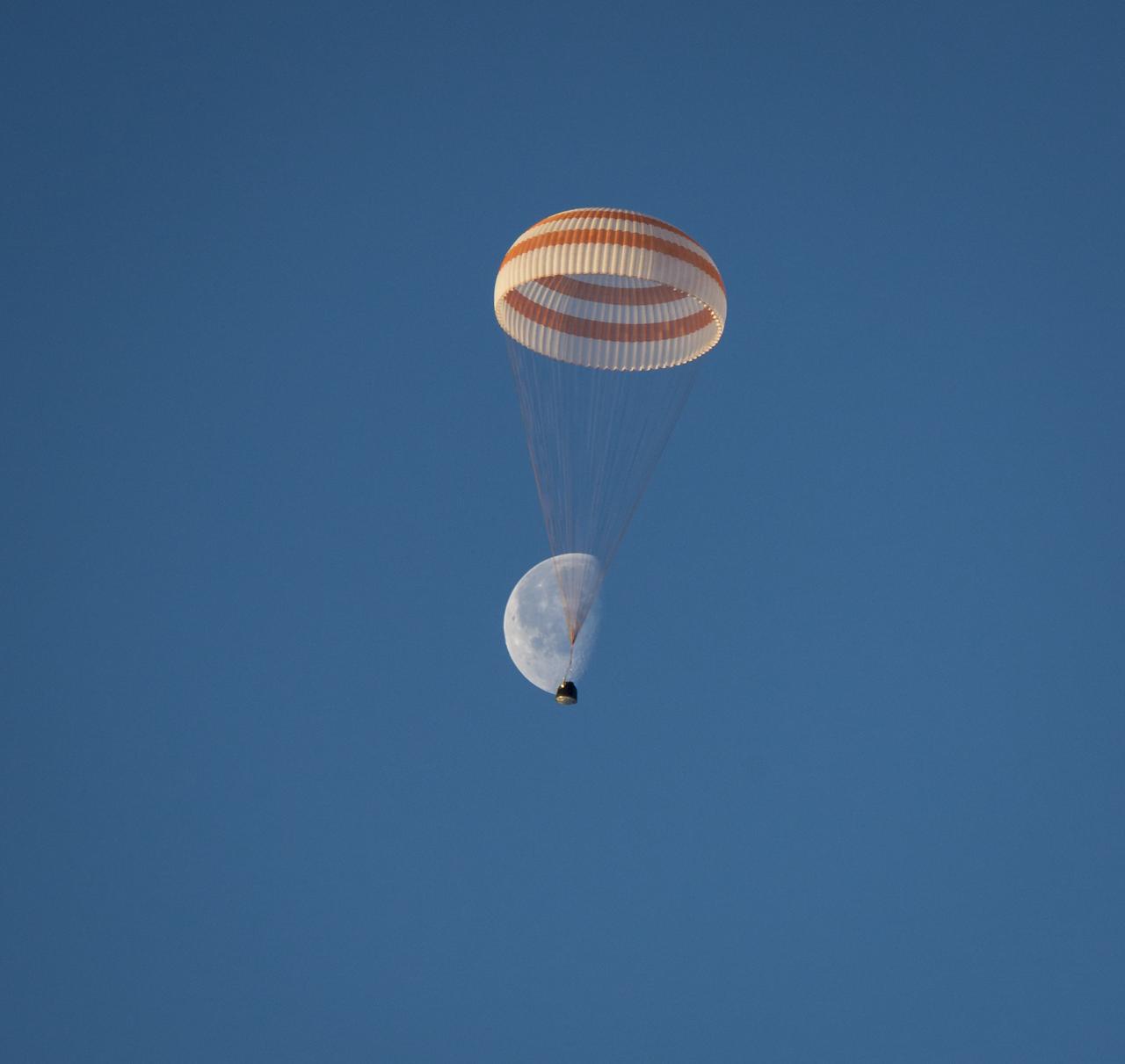 The Soyuz TMA-14M spacecraft is seen as it lands with Expedition 42 commander Barry Wilmore of NASA, Alexander Samokutyaev of the Russian Federal Space Agency (Roscosmos) and Elena Serova of Roscosmos near the town of Zhezkazgan, Kazakhstan on Thursday, March 12, 2015. NASA Astronaut Wilmore, Russian Cosmonauts Samokutyaev and Serova are returning after almost six months onboard the International Space Station where they served as members of the Expedition 41 and 42 crews. Photo Credit: (NASA/Bill Ingalls)