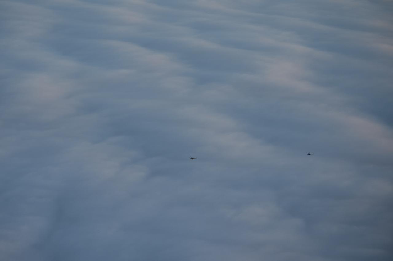 Russian MI-8 Helicopters are seen during the Soyuz TMA-14M spacecraft landing with Expedition 42 commander Barry Wilmore of NASA, Alexander Samokutyaev of the Russian Federal Space Agency (Roscosmos) and Elena Serova of Roscosmos near the town of Zhezkazgan, Kazakhstan on Thursday, March 12, 2015. NASA Astronaut Wilmore, Russian Cosmonauts Samokutyaev and Serova are returning after almost six months onboard the International Space Station where they served as members of the Expedition 41 and 42 crews. Photo Credit: (NASA/Bill Ingalls)
