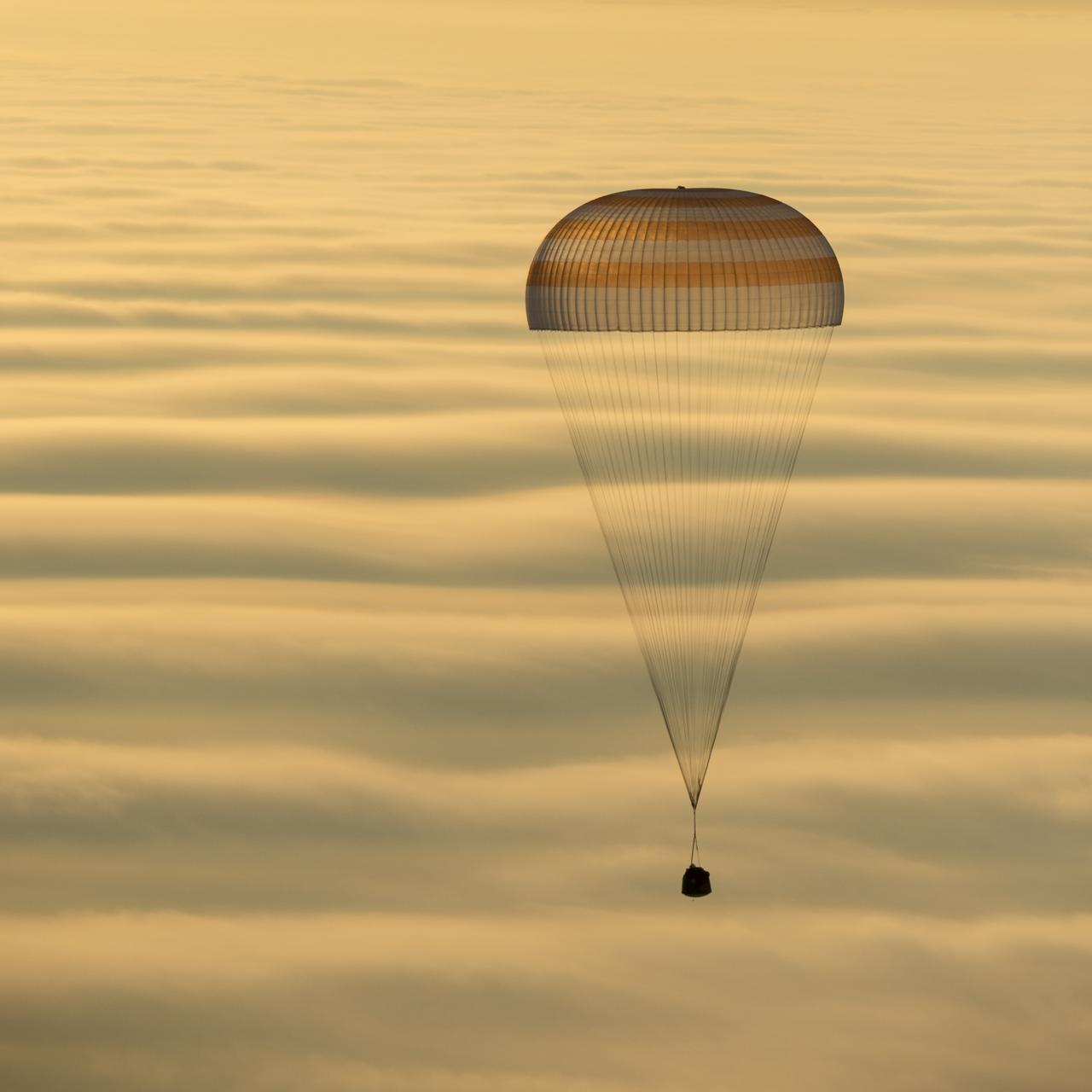 The Soyuz TMA-14M spacecraft is seen as it lands with Expedition 42 commander Barry Wilmore of NASA, Alexander Samokutyaev of the Russian Federal Space Agency (Roscosmos) and Elena Serova of Roscosmos near the town of Zhezkazgan, Kazakhstan on Thursday, March 12, 2015. NASA Astronaut Wilmore, Russian Cosmonauts Samokutyaev and Serova are returning after almost six months onboard the International Space Station where they served as members of the Expedition 41 and 42 crews. Photo Credit: (NASA/Bill Ingalls)
