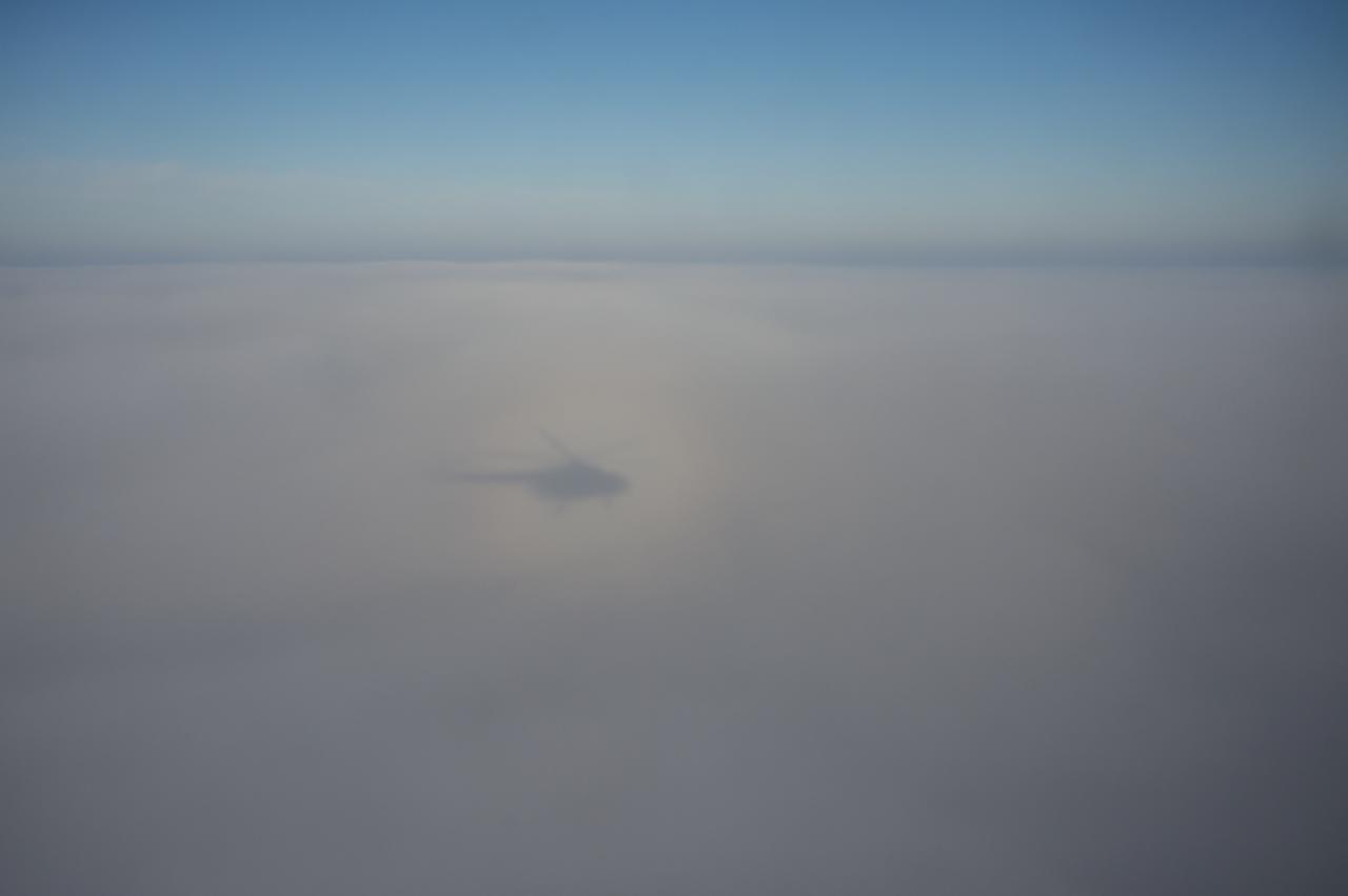 A shadow of a Russian MI-8 Helicopter is seen during the Soyuz TMA-14M spacecraft landing with Expedition 42 commander Barry Wilmore of NASA, Alexander Samokutyaev of the Russian Federal Space Agency (Roscosmos) and Elena Serova of Roscosmos near the town of Zhezkazgan, Kazakhstan on Thursday, March 12, 2015. NASA Astronaut Wilmore, Russian Cosmonauts Samokutyaev and Serova are returning after almost six months onboard the International Space Station where they served as members of the Expedition 41 and 42 crews. Photo Credit: (NASA/Bill Ingalls)