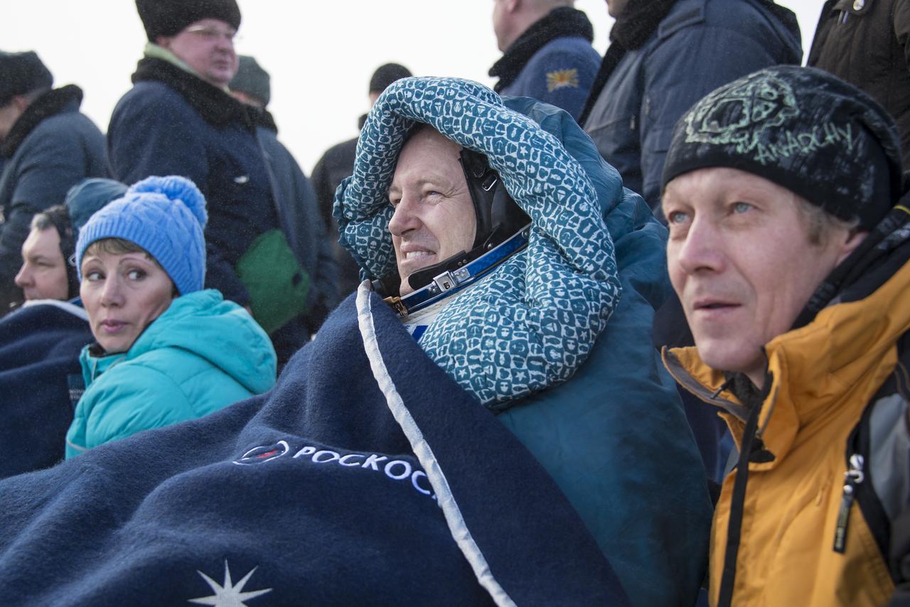 Expedition 42 commander Barry Wilmore of NASA rests in a chair outside the Soyuz TMA-14M spacecraft just minutes after he and Alexander Samokutyaev of the Russian Federal Space Agency (Roscosmos), and Elena Serova of Roscosmos landed in a remote area near the town of Zhezkazgan, Kazakhstan on Thursday, March 12, 2015. NASA Astronaut Wilmore, Russian Cosmonauts Samokutyaev and Serova are returning after almost six months onboard the International Space Station where they served as members of the Expedition 41 and 42 crews. Photo Credit: (NASA/Bill Ingalls)