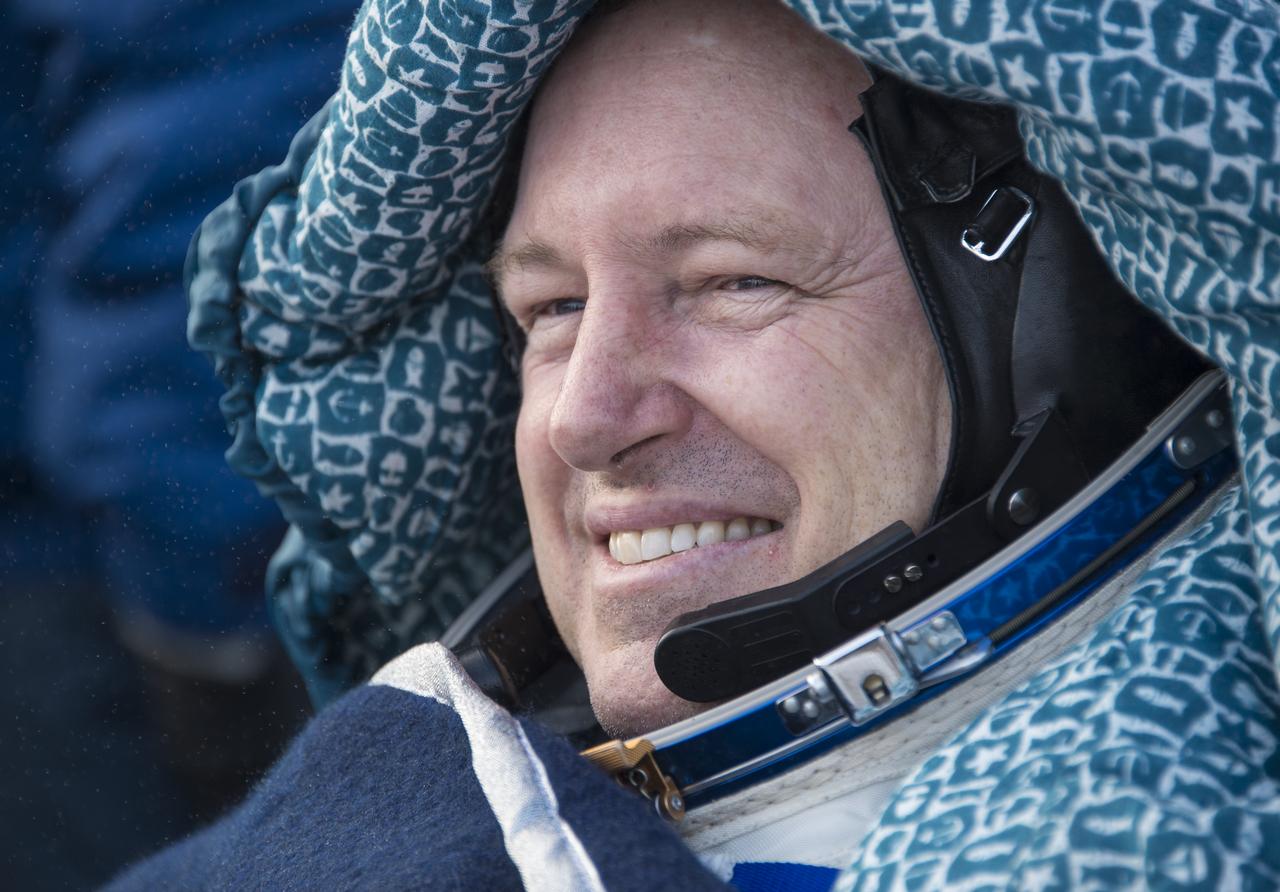 Expedition 42 commander Barry Wilmore of NASA rests in a chair outside the Soyuz TMA-14M spacecraft just minutes after he and Alexander Samokutyaev of the Russian Federal Space Agency (Roscosmos), and Elena Serova of Roscosmos landed in a remote area near the town of Zhezkazgan, Kazakhstan on Thursday, March 12, 2015. NASA Astronaut Wilmore, Russian Cosmonauts Samokutyaev and Serova are returning after almost six months onboard the International Space Station where they served as members of the Expedition 41 and 42 crews. Photo Credit: (NASA/Bill Ingalls)