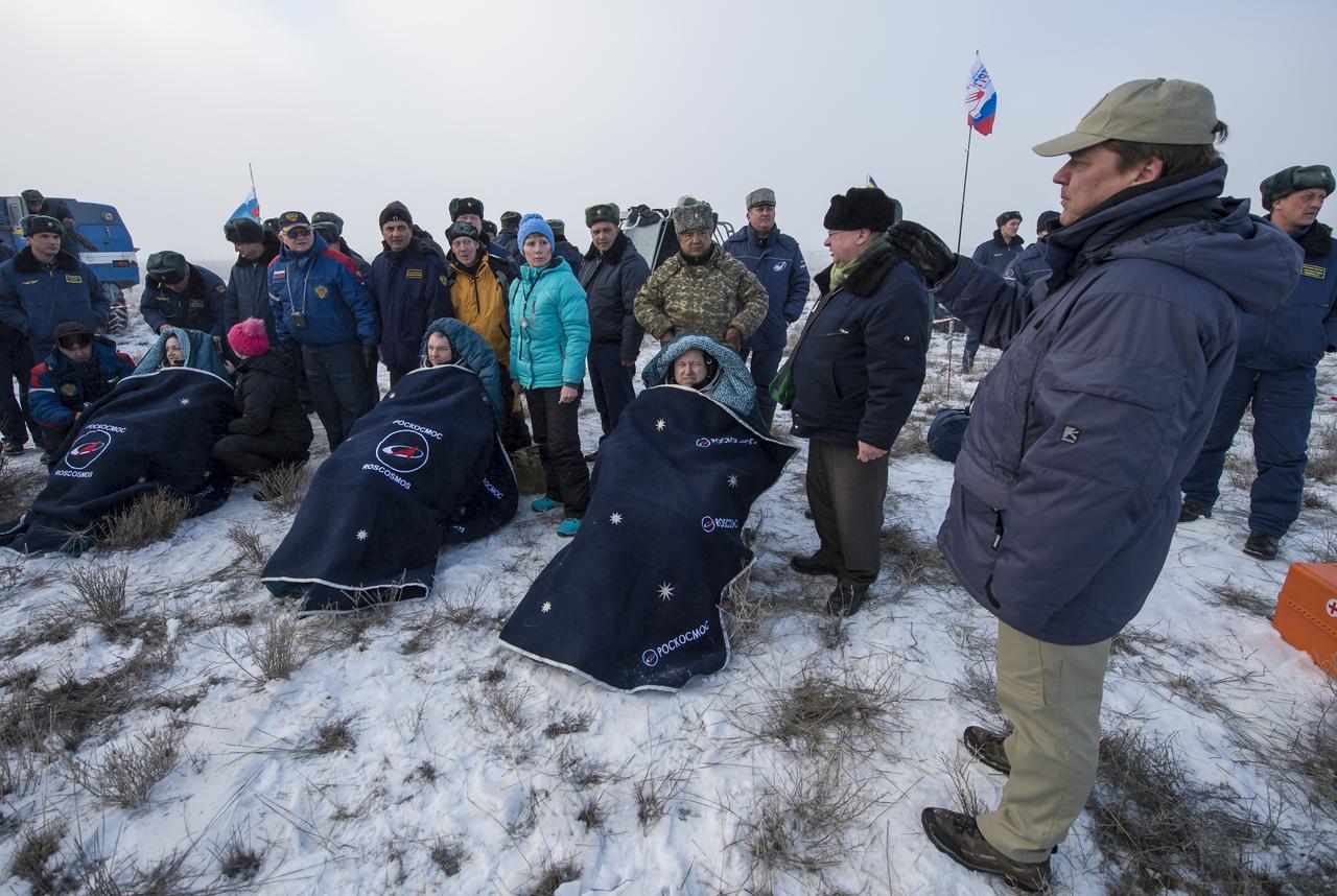 Expedition 42 Cosmonaut Elena Serova of the Russian Federal Space Agency (Roscosmos, left, Alexander Samokutyaev of Roscosmos, center, and NASA Astronaut Barry Wilmore of NASA sit in chairs outside the Soyuz TMA-14M spacecraft just minutes after they landed in a remote area near the town of Zhezkazgan, Kazakhstan on Thursday, March 12, 2015. NASA Astronaut Wilmore, Russian Cosmonauts Samokutyaev and Serova are returning after almost six months onboard the International Space Station where they served as members of the Expedition 41 and 42 crews. Photo Credit: (NASA/Bill Ingalls)