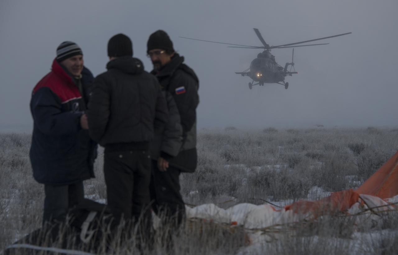 A Russian MI-8 Helicopter arrives at the Soyuz TMA-14M spacecraft landing site after the soyuz landed with Expedition 42 commander Barry Wilmore of NASA, Alexander Samokutyaev of the Russian Federal Space Agency (Roscosmos) and Elena Serova of Roscosmos near the town of Zhezkazgan, Kazakhstan on Thursday, March 12, 2015. NASA Astronaut Wilmore, Russian Cosmonauts Samokutyaev and Serova are returning after almost six months onboard the International Space Station where they served as members of the Expedition 41 and 42 crews. Photo Credit: (NASA/Bill Ingalls)