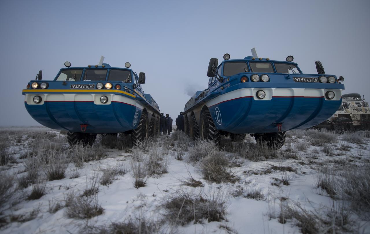 Russian all terrain vehicles (ATVs) are seen at the Soyuz TMA-14M spacecraft landing site shortly after the capsule landed with Expedition 42 commander Barry Wilmore of NASA, Alexander Samokutyaev of the Russian Federal Space Agency (Roscosmos) and Elena Serova of Roscosmos near the town of Zhezkazgan, Kazakhstan on Thursday, March 12, 2015. NASA Astronaut Wilmore, Russian Cosmonauts Samokutyaev and Serova are returning after almost six months onboard the International Space Station where they served as members of the Expedition 41 and 42 crews. Photo Credit: (NASA/Bill Ingalls)
