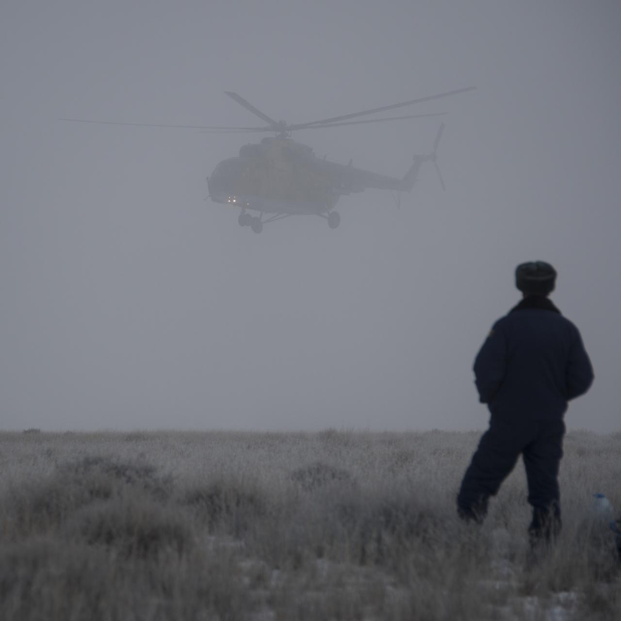 A Russian MI-8 Helicopter arrives at the Soyuz TMA-14M spacecraft landing site after the soyuz landed with Expedition 42 commander Barry Wilmore of NASA, Alexander Samokutyaev of the Russian Federal Space Agency (Roscosmos) and Elena Serova of Roscosmos near the town of Zhezkazgan, Kazakhstan on Thursday, March 12, 2015. NASA Astronaut Wilmore, Russian Cosmonauts Samokutyaev and Serova are returning after almost six months onboard the International Space Station where they served as members of the Expedition 41 and 42 crews. Photo Credit: (NASA/Bill Ingalls)