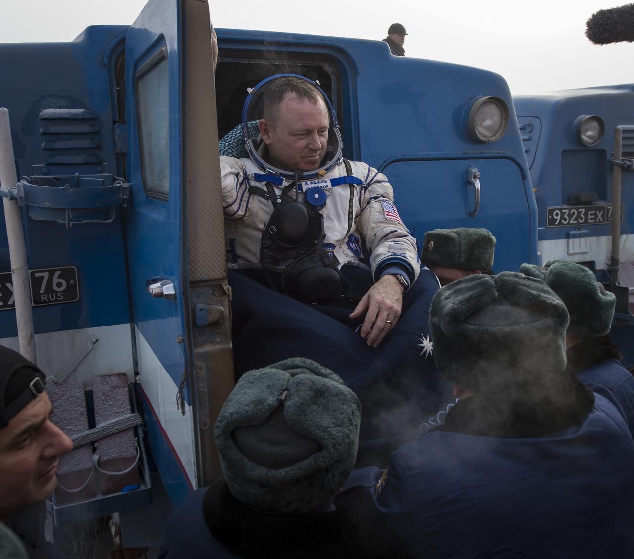 Expedition 42 commander Barry Wilmore of NASA is carried from all terrain vehicle (ATV) into a medical tent shortly after he and Alexander Samokutyaev of the Russian Federal Space Agency (Roscosmos), and Elena Serova of Roscosmos landed in their Soyuz TMA-14M spacecraft in a remote area near the town of Zhezkazgan, Kazakhstan on Thursday, March 12, 2015. NASA Astronaut Wilmore, Russian Cosmonauts Samokutyaev and Serova are returning after almost six months onboard the International Space Station where they served as members of the Expedition 41 and 42 crews. Photo Credit: (NASA/Bill Ingalls)