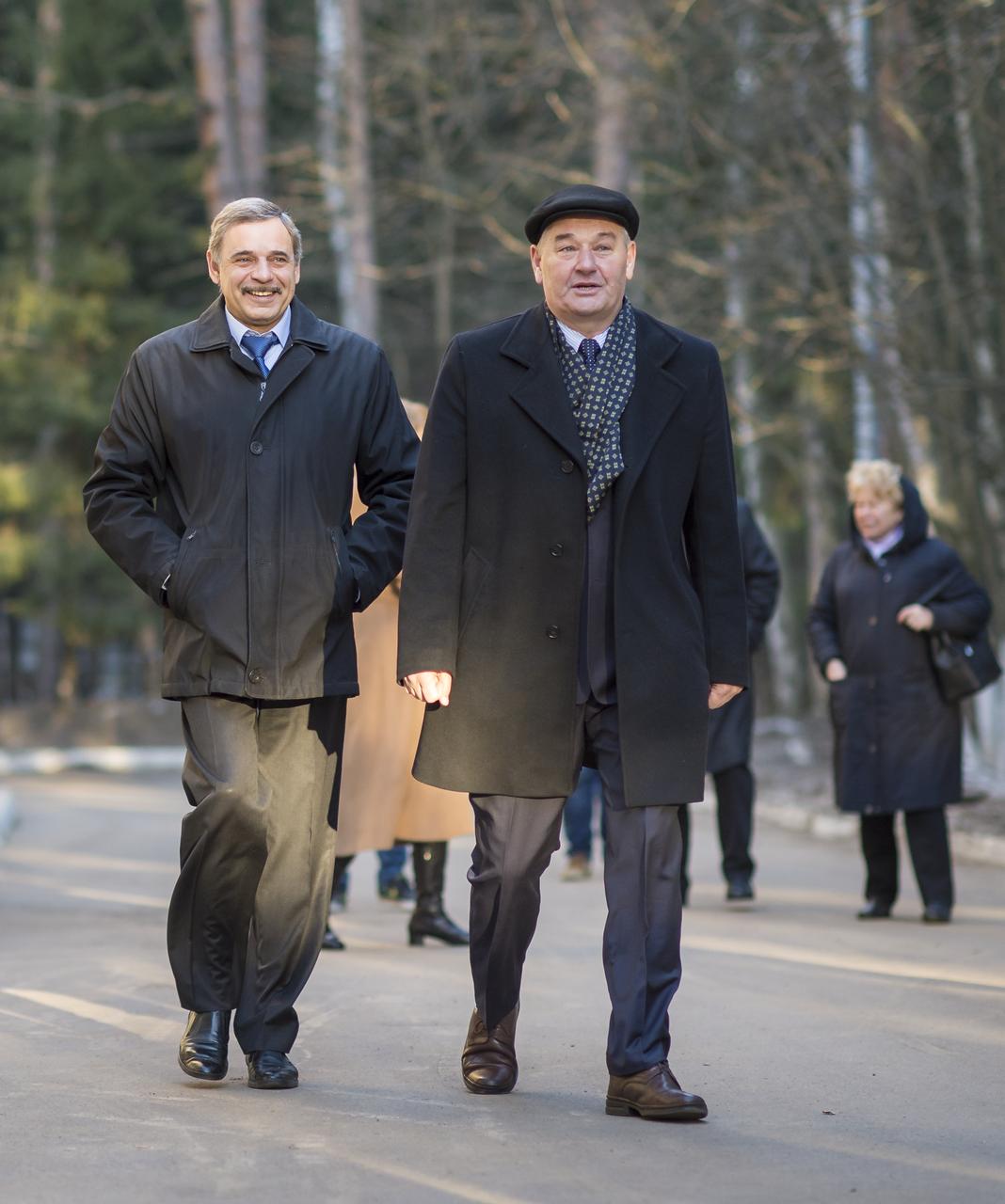 Russian Cosmonaut Mikhail Kornienko of the Russian Federal Space Agency (Roscosmos), left, and Commander of the cosmonaut corps Gagarin Cosmonaut Training Center (GCTC) Valery Korzun walk to meet with Expedition 43 crew members, Gennady Padalka of Roscosmos, and NASA Astronaut Scott Kelly prior to their departure later in the morning from GCTC, Star City Russia to Baikonur, Kazakhstan, Saturday, March 14, 2015. The trio is preparing for launch to the International Space Station in their Soyuz TMA-16M spacecraft from the Baikonur Cosmodrome in Kazakhstan March 28, Kazakh time. As the one-year crew, Kelly and Kornienko will return to Earth on Soyuz TMA-18M in March 2016. Photo Credit: (NASA/Bill Ingalls)