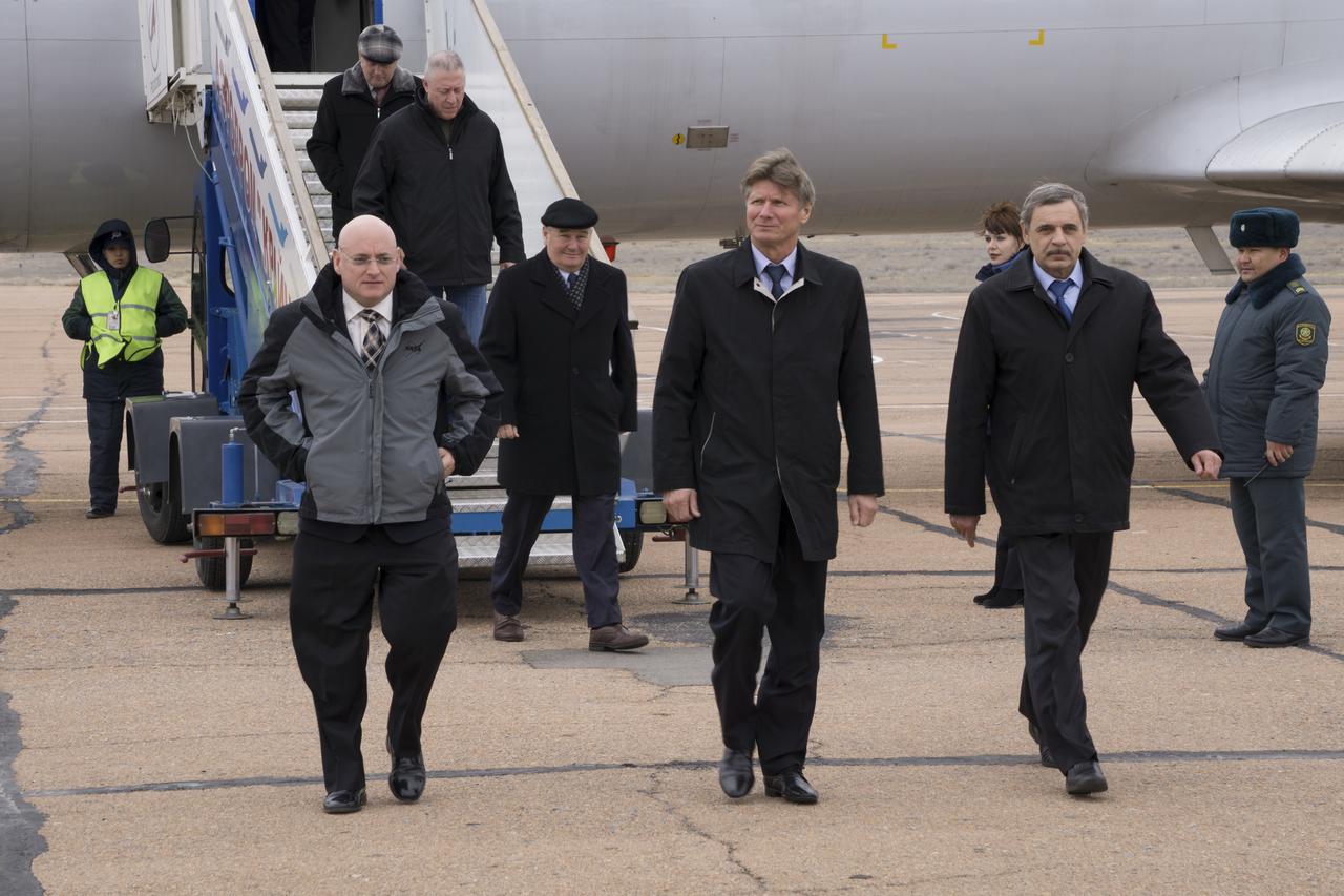 Expedition 43 NASA Astronaut Scott Kelly, left, Russian Cosmonauts Gennady Padalka, center, and Mikhail Kornienko of the Russian Federal Space Agency (Roscosmos) exit the Gagarin Cosmonaut Training Center (GCTC) aircraft after arriving in Baikonur, Kazakhstan, Saturday, March 14, 2015. The trio are preparing for launch to the International Space Station in their Soyuz TMA-16M spacecraft from the Baikonur Cosmodrome in Kazakhstan March 28, Kazakh time. As the one-year crew, Kelly and Kornienko will return to Earth on Soyuz TMA-18M in March 2016. Photo Credit: (NASA/Victor Zelentsov)