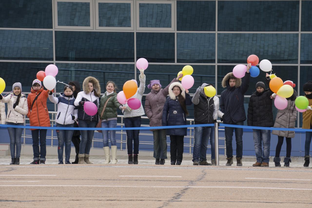 Well wishers welcome Expedition 43 NASA Astronaut Scott Kelly, Russian Cosmonauts Gennady Padalka and Mikhail Kornienko of the Russian Federal Space Agency (Roscosmos) after as they arrive in Baikonur, Kazakhstan, Saturday, March 14, 2015. The trio are preparing for launch to the International Space Station in their Soyuz TMA-16M spacecraft from the Baikonur Cosmodrome in Kazakhstan March 28, Kazakh time. As the one-year crew, Kelly and Kornienko will return to Earth on Soyuz TMA-18M in March 2016. Photo Credit: (NASA/Victor Zelentsov)