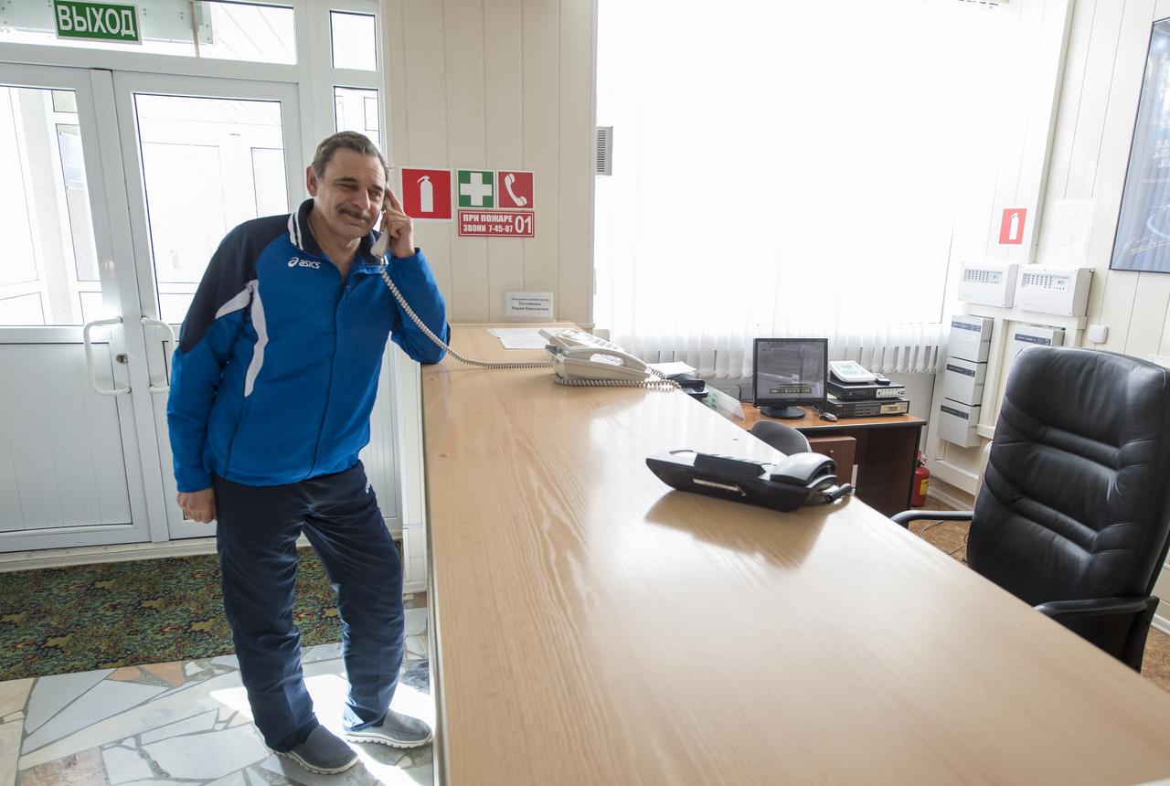 Expedition 43 Russian Cosmonaut Mikhail Kornienko of the Russian Federal Space Agency (Roscosmos) takes a break between classes to make a phone call, Thursday, March 19, 2015 at Cosmonaut Hotel in Baikonur, Kazakhstan. Kornienko, NASA Astronaut Scott Kelly and Russian Cosmonaut Gennady Padalka of Roscosmos are preparing for launch to the International Space Station in their Soyuz TMA-16M spacecraft from the Baikonur Cosmodrome in Kazakhstan March 28, Kazakh time. As the one-year crew, Kelly and Kornienko will return to Earth on Soyuz TMA-18M in March 2016. Photo Credit: (NASA/Bill Ingalls)