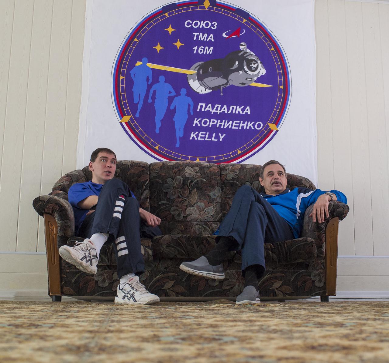 Expedition 43 backup crew member Sergei Volkov of the Russian Federal Space Agency (Roscosmos), left, and Expedition 43 prime crew member Mikhail Kornienko of Roscosmos watch television during a break between classes, Thursday, March 19, 2015 at Cosmonaut Hotel in Baikonur, Kazakhstan. Kornienko and fellow crew members, NASA Astronaut Scott Kelly and Russian Cosmonaut Gennady Padalka of Roscosmos are preparing for launch to the International Space Station in their Soyuz TMA-16M spacecraft from the Baikonur Cosmodrome in Kazakhstan March 28, Kazakh time. As the one-year crew, Kelly and Kornienko will return to Earth on Soyuz TMA-18M in March 2016. Photo Credit: (NASA/Bill Ingalls)
