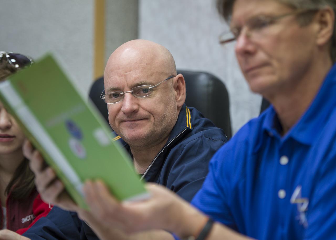 Expedition 43 NASA Astronaut Scott Kelly, left, and Russian Cosmonaut Gennady Padalka of the Russian Federal Space Agency (Roscosmos) are seen during an Soyuz TMA-16M Trajectory and Flight Plan briefing, Thursday, March 19, 2015 at Cosmonaut Hotel in Baikonur, Kazakhstan. Kelly, Padalka, and Russian Cosmonaut Mikhail Kornienko of Roscosmos are preparing for launch to the International Space Station in their Soyuz TMA-16M spacecraft from the Baikonur Cosmodrome in Kazakhstan March 28, Kazakh time. As the one-year crew, Kelly and Kornienko will return to Earth on Soyuz TMA-18M in March 2016. Photo Credit: (NASA/Bill Ingalls)