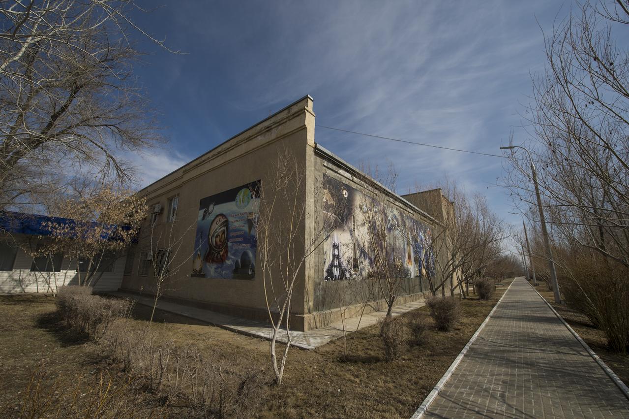 Murals showing the history of Russian spaceflight are seen on the outside walls of the Cosmonaut Hotel, Thursday, March 19, 2015 in Baikonur, Kazakhstan. NASA Astronaut Scott Kelly, and Russian Cosmonauts Gennady Padalka, and Mikhail Kornienko of the Russian Federal Space Agency (Roscosmos), are preparing for launch to the International Space Station in their Soyuz TMA-16M spacecraft from the Baikonur Cosmodrome in Kazakhstan March 28, Kazakh time. As the one-year crew, Kelly and Kornienko will return to Earth on Soyuz TMA-18M in March 2016. Photo Credit: (NASA/Bill Ingalls)