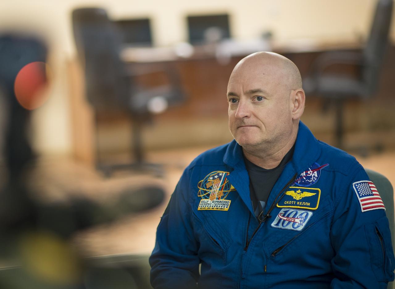 Expedition 43 NASA Astronaut Scott Kelly sits down for a television interview at the Cosmonaut Hotel, Thursday, March 19, 2015 in Baikonur, Kazakhstan. Kelly, and Russian Cosmonauts Gennady Padalka, and Mikhail Kornienko of the Russian Federal Space Agency (Roscosmos) are preparing for launch to the International Space Station in their Soyuz TMA-16M spacecraft from the Baikonur Cosmodrome in Kazakhstan March 28, Kazakh time. As the one-year crew, Kelly and Kornienko will return to Earth on Soyuz TMA-18M in March 2016. Photo Credit: (NASA/Bill Ingalls)