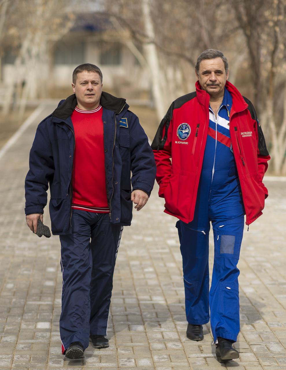 Gagarin Cosmonaut Training Center (GCTC) Flight Surgeon Alexey Grishin, left, and Expedition 43 Russian Cosmonaut Mikhail Kornienko of the Russian Federal Space Agency (Roscosmos) walk from morning classes at the Cosmonaut Hotel to the crew quarters at the Zvjozdnyj Hotel, Thursday, March 19, 2015 in Baikonur, Kazakhstan. Kornienko, Russian Cosmonaut Gennady Padalka of Roscosmos, and NASA Astoronaut Scott Kelly are preparing for launch to the International Space Station in their Soyuz TMA-16M spacecraft from the Baikonur Cosmodrome in Kazakhstan March 28, Kazakh time. As the one-year crew, Kelly and Kornienko will return to Earth on Soyuz TMA-18M in March 2016. Photo Credit: (NASA/Bill Ingalls)