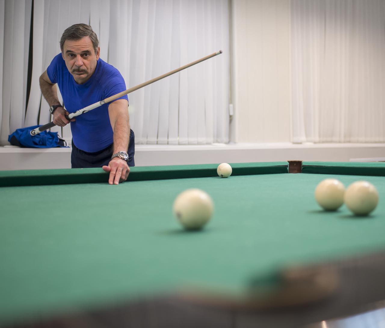Expedition 43 Russian Cosmonaut Mikhail Kornienko of the Russian Federal Space Agency (Roscosmos) plays pool with NASA Astronaut Scott Kelly at the Cosmonaut Hotel, Thursday, March 19, 2015 in Baikonur, Kazakhstan. Kelly, Kornienko, and Russian Cosmonaut Gennady Padalka are preparing for launch to the International Space Station in their Soyuz TMA-16M spacecraft from the Baikonur Cosmodrome in Kazakhstan March 28, Kazakh time. As the one-year crew, Kelly and Kornienko will return to Earth on Soyuz TMA-18M in March 2016. Photo Credit: (NASA/Bill Ingalls)