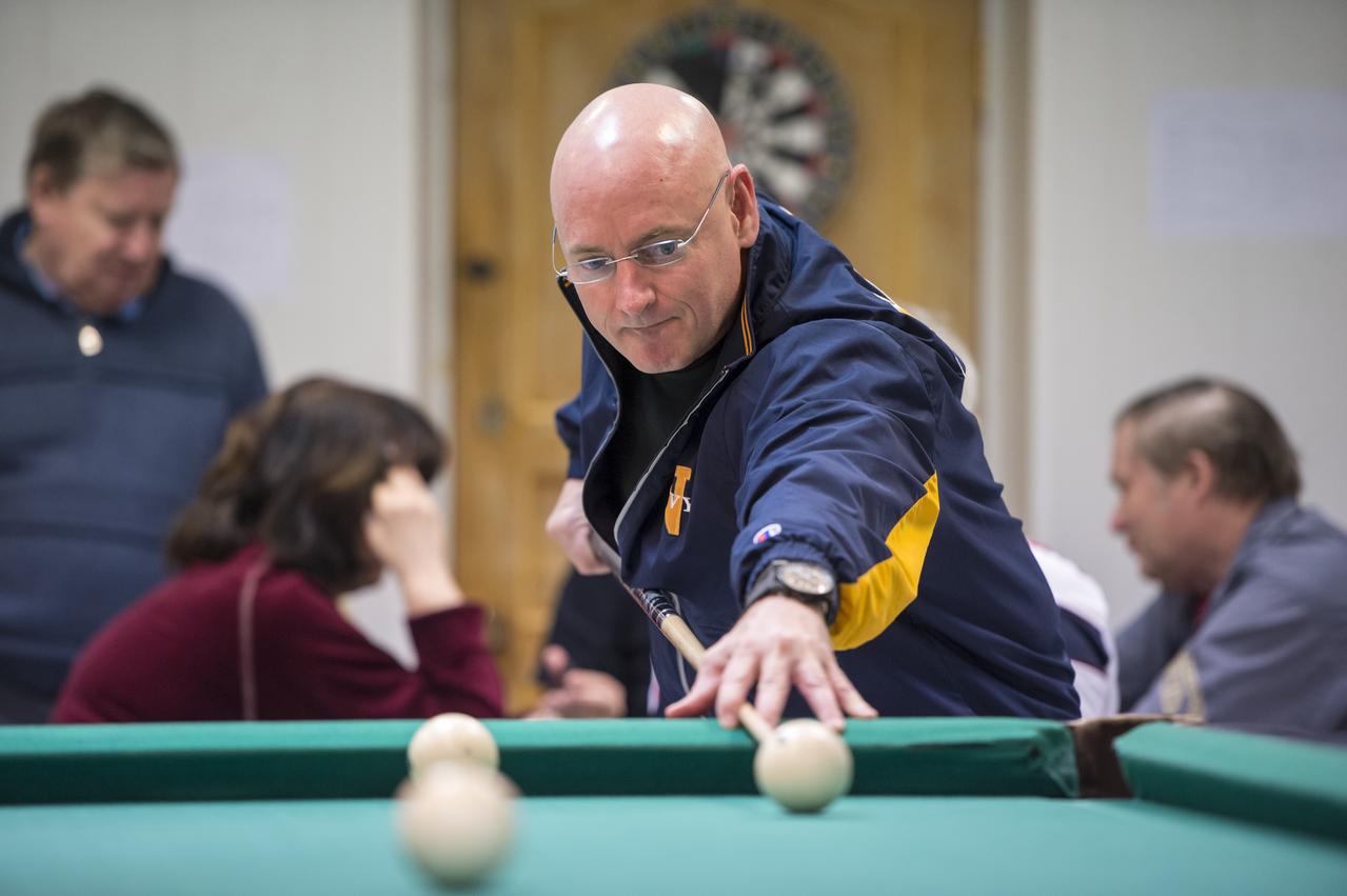 Expedition 43 NASA Astronaut Scott Kelly plays pool with Russian Cosmonaut Mikhail Kornienko of the Russian Federal Space Agency (Roscosmos) at the Cosmonaut Hotel, Thursday, March 19, 2015 in Baikonur, Kazakhstan. Kelly, Kornienko, and Russian Cosmonaut Gennady Padalka are preparing for launch to the International Space Station in their Soyuz TMA-16M spacecraft from the Baikonur Cosmodrome in Kazakhstan March 28, Kazakh time. As the one-year crew, Kelly and Kornienko will return to Earth on Soyuz TMA-18M in March 2016. Photo Credit: (NASA/Bill Ingalls)