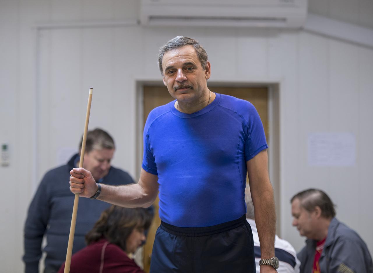 Expedition 43 Russian Cosmonaut Mikhail Kornienko of the Russian Federal Space Agency (Roscosmos) plays pool with NASA Astronaut Scott Kelly at the Cosmonaut Hotel, Thursday, March 19, 2015 in Baikonur, Kazakhstan. Kelly, Kornienko, and Russian Cosmonaut Gennady Padalka are preparing for launch to the International Space Station in their Soyuz TMA-16M spacecraft from the Baikonur Cosmodrome in Kazakhstan March 28, Kazakh time. As the one-year crew, Kelly and Kornienko will return to Earth on Soyuz TMA-18M in March 2016. Photo Credit: (NASA/Bill Ingalls)