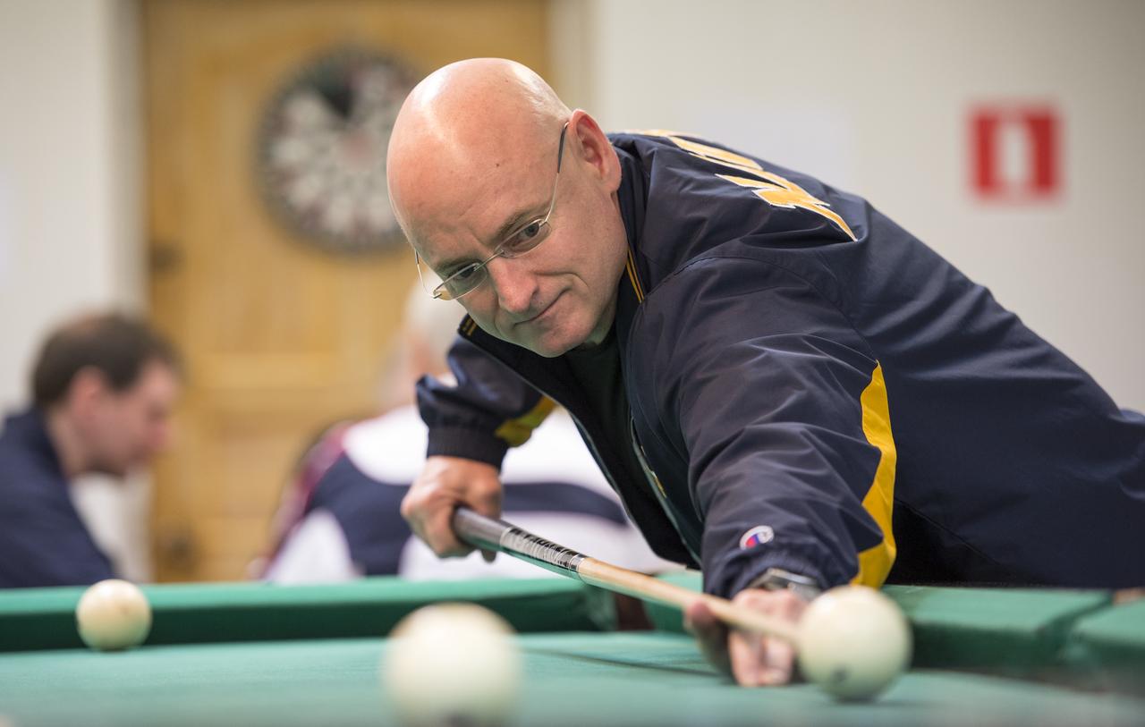 Expedition 43 NASA Astronaut Scott Kelly plays pool with Russian Cosmonaut Mikhail Kornienko of the Russian Federal Space Agency (Roscosmos) at the Cosmonaut Hotel, Thursday, March 19, 2015 in Baikonur, Kazakhstan. Kelly, Kornienko, and Russian Cosmonaut Gennady Padalka are preparing for launch to the International Space Station in their Soyuz TMA-16M spacecraft from the Baikonur Cosmodrome in Kazakhstan March 28, Kazakh time. As the one-year crew, Kelly and Kornienko will return to Earth on Soyuz TMA-18M in March 2016. Photo Credit: (NASA/Bill Ingalls)