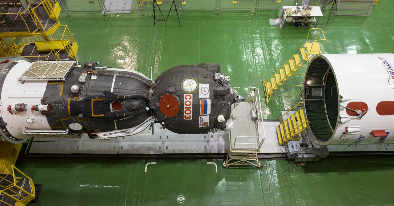 The Soyuz TMA-16M spacecraft is seen after being lowered into position for encapsulation with its fairing, Friday, March 20, 2015 at the Baikonur Cosmodrome in Kazakhstan. Expedition 43 NASA Astronaut Scott Kelly, and Russian Cosmonauts Gennady Padalka, and Mikhail Kornienko of the Russian Federal Space Agency (Roscosmos) are scheduled to launch to the International Space Station in the Soyuz TMA-16M spacecraft from the Baikonur Cosmodrome in Kazakhstan March 28, Kazakh time. As the one-year crew, Kelly and Kornienko will return to Earth on Soyuz TMA-18M in March 2016. Photo Credit: (NASA/Bill Ingalls)