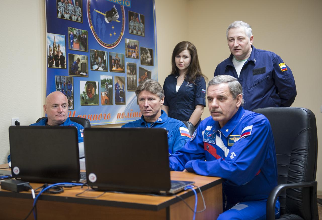 Expedition 43 NASA Astronaut Scott Kelly, seated left, Russian Cosmonauts Gennady Padalka, center, and Mikhail Kornienko of the Russian Federal Space Agency (Roscosmos), work on Soyuz training, Saturday, March 21, 2015 at the Cosmonaut Hotel in Baikonur, Kazakhstan. Kelly, Padalka, and Kornienko are preparing for launch to the International Space Station in their Soyuz TMA-16M spacecraft from the Baikonur Cosmodrome in Kazakhstan March 28, Kazakh time (March 27 Eastern time.) As the one-year crew, Kelly and Kornienko will return to Earth on Soyuz TMA-18M in March 2016. Photo Credit: (NASA/Bill Ingalls)